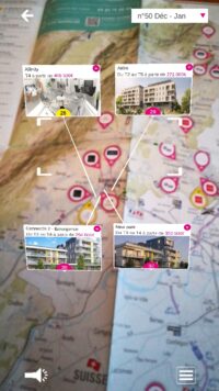 Capture d'écran de l'utilisation de l'application mobile Plan Immobilier. On voit une carte physique filmée avec par dessus en réalité augmentée des étiquettes montrant le détail de bien immobiliers.